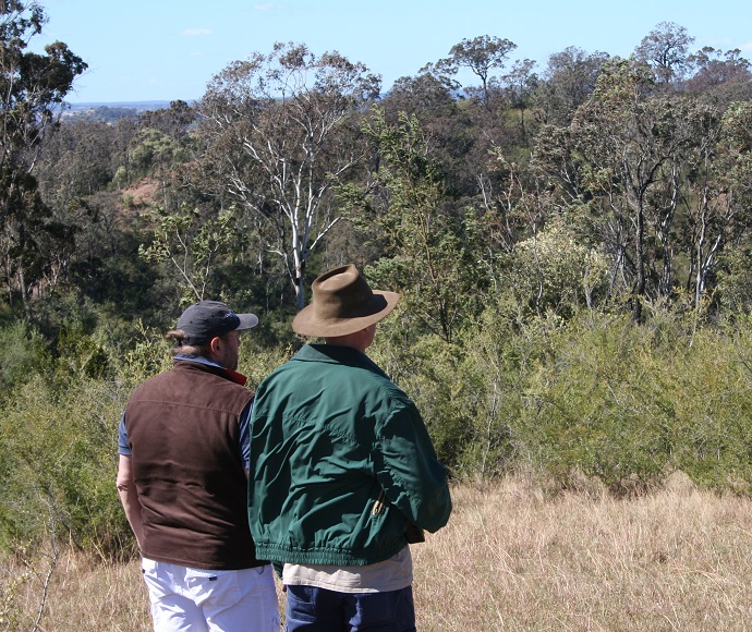 Two people looking at the landscape on Montpelier Lot 64 stewardship site